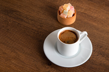 Traditional Turkish delight and Turkish coffee on a wooden background,top view	