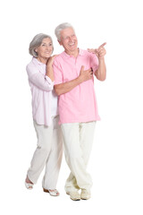 portrait of  senior couple pointing something