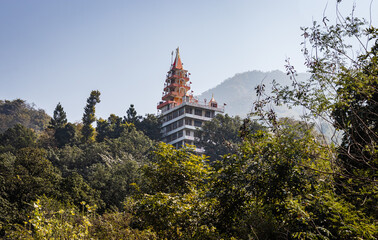 hindu ancient temple nestled in dense green forest at morning
