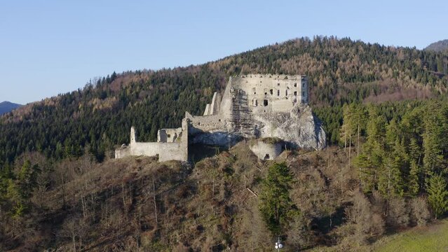 Likava Castle Ruins Atop Hills In Likavka, Slovakia. Aerial Pullback