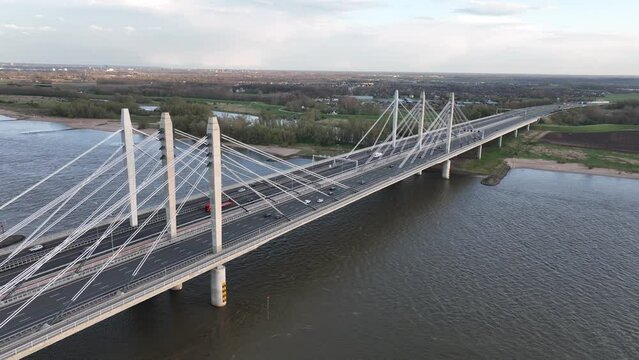 Road surface and traffic on Tacitusbrug bij Ewijk modern suspension bridge crossing the river Waal near Nijmegen, the Netherlands Holland Europe. Valburg and Ewijk.