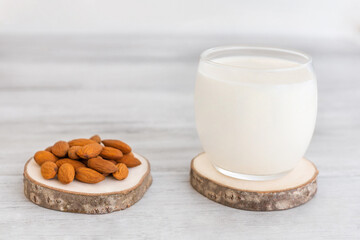 Vegan Nut Milk. Almond Milk in glass and almond nuts. Copy space . Top view 