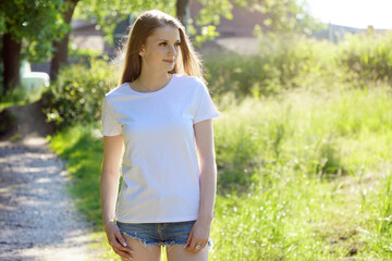 Beautiful teenage girl wears white shirt with text space or copy space for print, design or logo	
