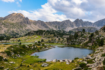 Sunset in the mountain lake (Lake of Pessons, Andorra)