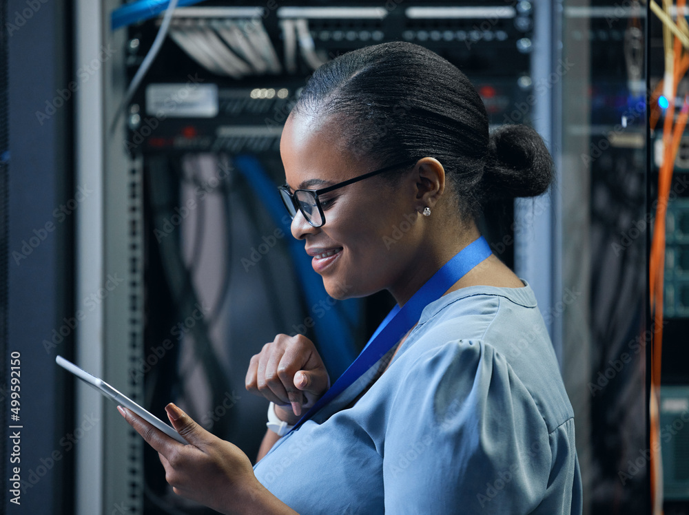 Poster Let her rewire your network. Cropped shot of an attractive female programmer working on a tablet in a server room.