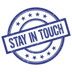 STAY IN TOUCH text written on blue vintage round stamp.