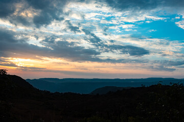 dramatic sunset colorful sky over mountain shadow at morning from flat angle