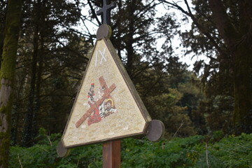 Artistic sign indicating the 9th stop of a via crucis in the mountains