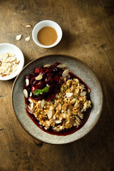 Healthy oatmeal porridge with cherries and almond