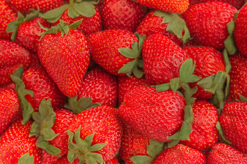 Fresh strawberries on white wooden background. Top view with space. Nature fruit concept and healty eating