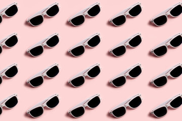 White sunglasses pattern on pastel pink background