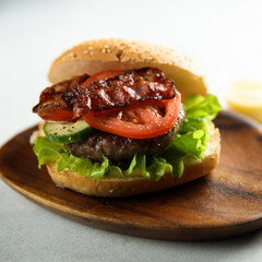Homemade burger with fried bacon