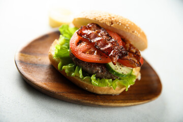 Homemade burger with fried bacon
