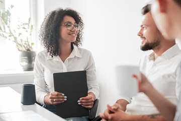 Businesswoman working with male colleagues