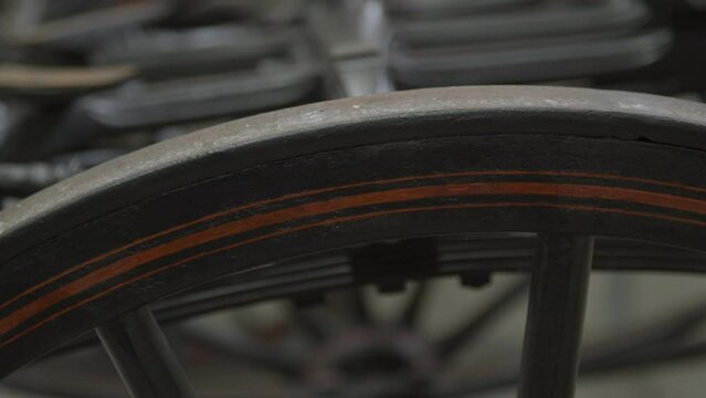 Close up of pinstripes on old carriage wheel