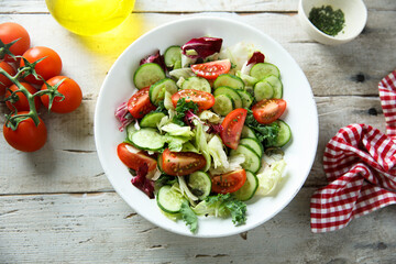 Healthy green salad with tomato and cucumber