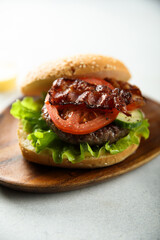 Homemade burger with fried bacon