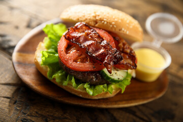 Homemade burger with fried bacon
