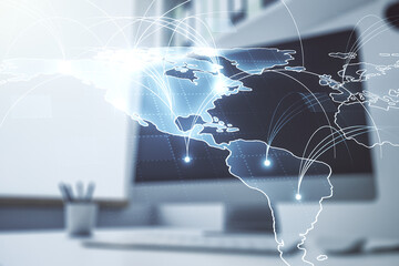 Double exposure of abstract digital world map with connections and modern desk with computer on background, big data and blockchain concept