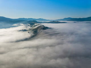 Morning fog in the Ukrainian Carpathians. Aerial drone view.