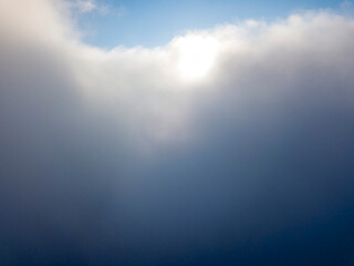 Fototapeta premium High flight above the clouds. Aerial drone view.
