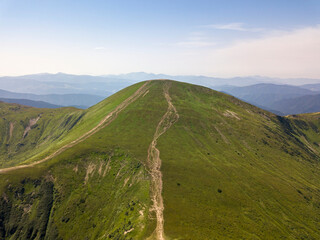 High mountains of the Ukrainian Carpathians in cloudy weather. Aerial drone view.