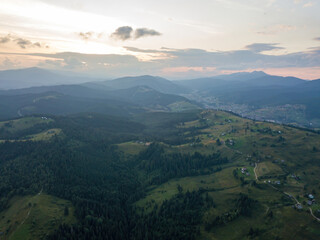 Fototapeta premium Sunset over the mountains in the Ukrainian Carpathians. Evening. Aerial drone view.