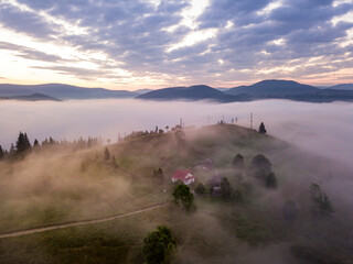 Morning fog in the Ukrainian Carpathians. Aerial drone view.