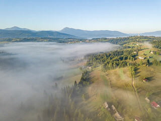 Morning fog in the Ukrainian Carpathians. Aerial drone view.
