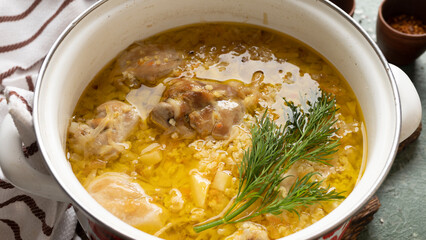 Delicious german soup eintopf with chicken and sauerkraut on the dinner table