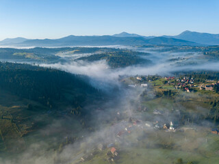 Morning fog in the Ukrainian Carpathians. Aerial drone view.