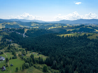 Green mountains of Ukrainian Carpathians in summer. Sunny day. Aerial drone view.