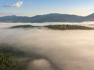 Morning fog in the Ukrainian Carpathians. Aerial drone view.