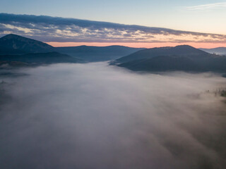 Morning fog in the Ukrainian Carpathians. Aerial drone view.