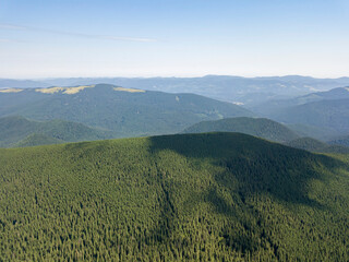 Fototapeta premium High mountains of the Ukrainian Carpathians in cloudy weather. Aerial drone view.