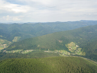 Obraz premium Green mountains of Ukrainian Carpathians in summer. Aerial drone view.
