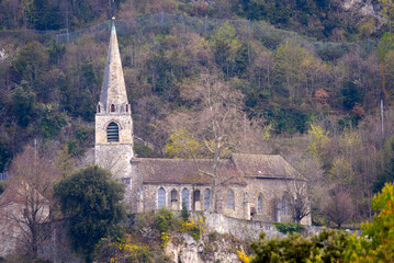 Fototapeta na wymiar Medieval church Saint Vincent on a hill at City of Montreux, Canton Vaud, on a cloudy spring day. Photo taken April 4th, 2022, Montreux, Switzerland.