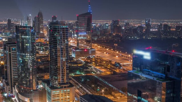 Aerial view of media city and al barsha heights district area all night timelapse from Dubai marina.