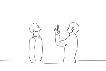 two men stand one pointing a finger to the sky and both look there - one line drawing vector. concept of diverting attention, looking at a bird or an airplane