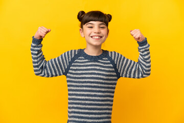 Little caucasian girl isolated on yellow background doing strong gesture