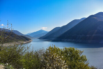 Landscape of the Zhinvali reservoir. Lake landscape with mountains, the main Caucasus range....