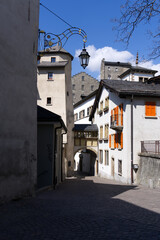 Medieval old town of City of Sion with alley and historic houses on a sunny spring day. Photo taken April 4th, 2022, Sion, Switzerland.