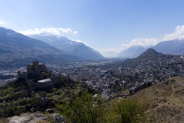 Fototapeta premium Beautiful medieval catholic church and castle Basilique de Valère (Valeria) on a hill at City of Sion on a sunny spring day. Photo taken April 4th, 2022, Sion, Switzerland.