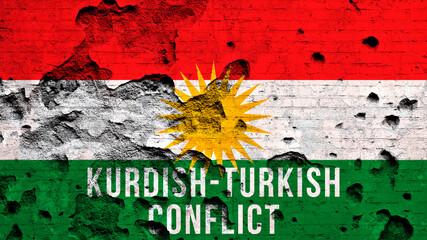 Kurdish-Turkish conflict background with flag of Kurdistan and text. War concept. Broken and damaged brick wall photo