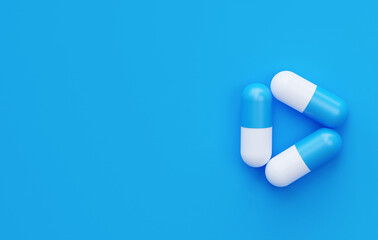 Three pills in the shape of a triangle on a blue background with an empty space. 3d rendering. Medical horizontal picture.