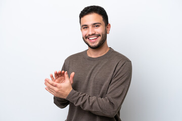 Young Brazilian man isolated on white background applauding