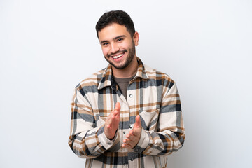 Young Brazilian man isolated on white background applauding after presentation in a conference