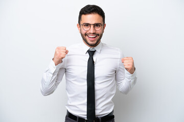 Business Brazilian man isolated on white background celebrating a victory in winner position