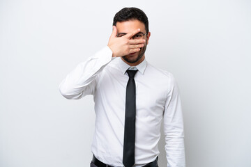 Business Brazilian man isolated on white background covering eyes by hands and smiling