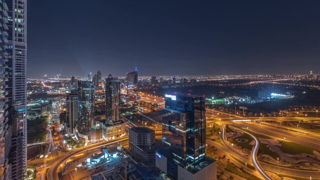 Aerial view of media city and al barsha heights district area all night timelapse from Dubai marina.